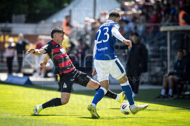 German 3rd Division, Viktoria Koeln vs. Energie Cottbus, 26.04.2026 | KOELN, GERMANY - APRIL 26, 2026:  Taylan Duman (FC Viktoria Koeln, 4) tackling Nyamekye Awortwie-Grant (Energie Cottbus, 23) during the 3rd division match on gameday 35 between Viktoria Koeln vs. Energie Cottbus at the Sportpark Hoehenberg on April 26, 2026 in Koeln, Germany. DFL REGULATIONS PROHIBIT ANY USE OF PHOTOGRAPHS AS IMAGE SEQUENCES AND/OR QUASI-VIDEO.