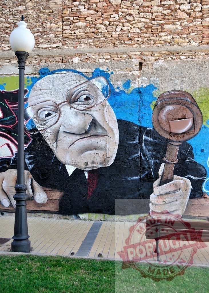 Judge holding gavel depicted in colorful street art graffiti on brick wall | Caricature of a stern judge holding a gavel, painted as graffiti art on a brick wall, adding a touch of urban art to a public space - Realized with Pictrs.com