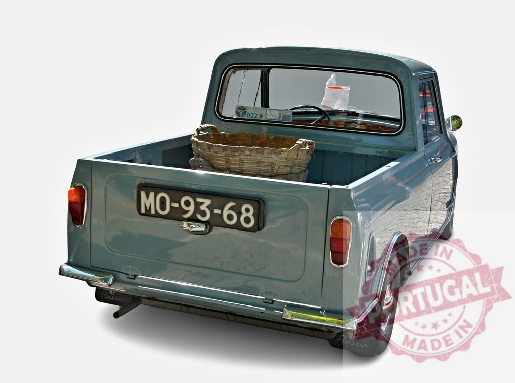 Classic Austin Mini Pickup Truck Carrying Wicker Basket | Light blue Austin Mini pickup truck parked with a wicker basket in the back - Realized with Pictrs.com