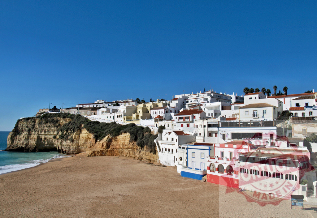 Albufeira old town with beach and cliffs overlooking Atlantic sea | Whitewashed village buildings sitting on rugged golden cliffs above a sandy beach and blue sea - Realized with Pictrs.com
