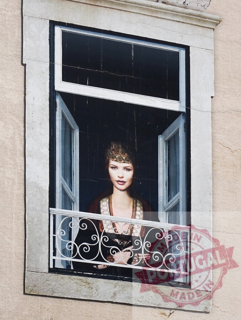 Woman wearing crown looking out from window illustration | Street art mural showing a woman wearing a golden crown looking out from an open window - Realized with Pictrs.com