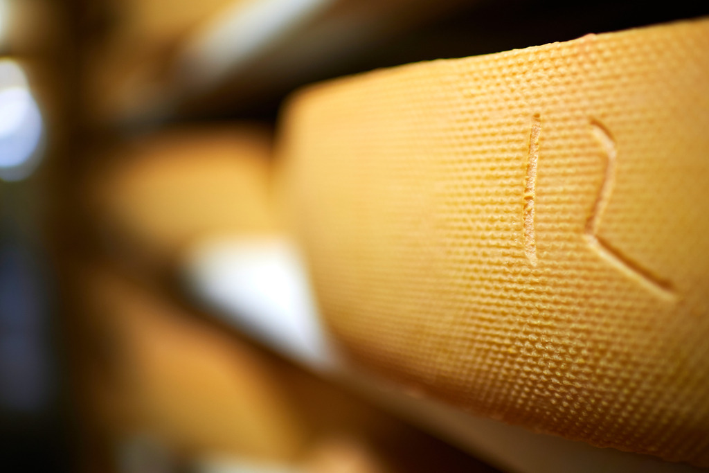 Sennerei Hittisau | Hittisau, Austria - July 29, 2019: Sennerei Hittisau; ein Blick in das Käselager mit Regalen und Käselaibe. - Realisiert mit Pictrs.com