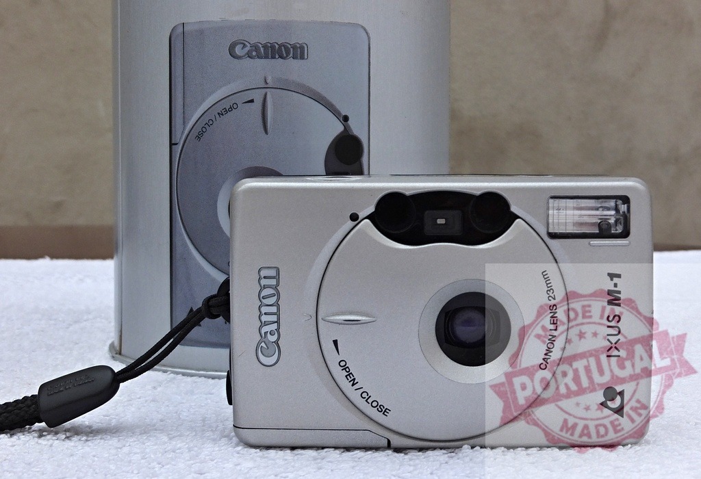 Canon IXUS M-1 APS compact film camera | Canon IXUS M-1 camera displaying vintage analog photography technology - Realized with Pictrs.com