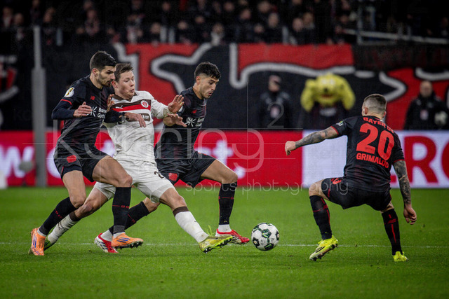 Bayer 04 Leverkusen vs. FC St. Pauli, 03.02.2026 | LEVERKUSEN, GERMANY - FEBRUARY 3:  Tackling between Martin Terrier (Bayer 04 Leverkusen, 11), Mathias Rasmussen (FC St. Pauli, 20), Exequiel Palacios (Bayer 04 Leverkusen, 25), Alejandro Grimaldo (Bayer 04 Leverkusen, 20) during the DFB Cup quarter-final match Bayer 04 Leverkusen vs. FC St. Pauli at BayArena on February 3, 2026 in Leverkusen, Germany. (Photo by Axel Kohring/Beautiful Sports Int.)DFL REGULATIONS PROHIBIT ANY USE OF PHOTOGRAPHS AS IMAGE SEQUENCES AND/OR QUASI-VIDEO.