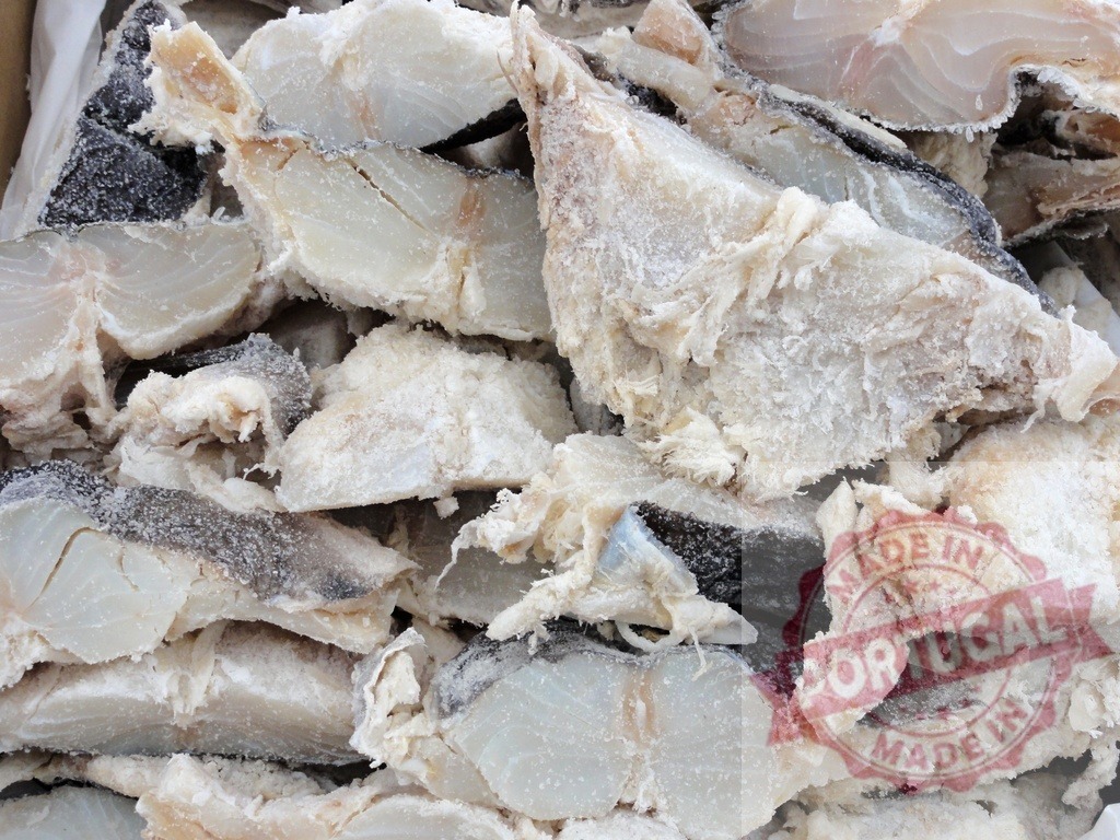 Dried salted cod fish pieces, traditional bacalhau | Dried salted cod fish pieces for sale, often used in Portuguese and Spanish cuisine - Realized with Pictrs.com