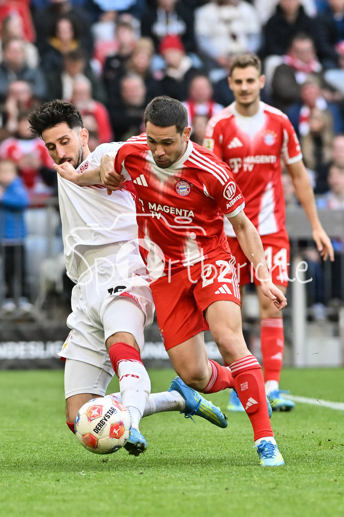 FC Bayern München - VfB Stuttgart | MUNICH, GERMANY - 19. APRIL: tackle between ATAKAN KARAZOR (VFB STUTTGART 16) and Raphael GUERREIRO (FC Bayern Munich 22) during the Bundesliga Match between FC Bayern Munich vs. VfB Stuttgart at Matchday 30 at Allianz Arena / DFL REGULATIONS PROHIBIT ANY USE OF PHOTOGRAPHS AS IMAGE SEQUENCES AND/OR QUASI-VIDEO
