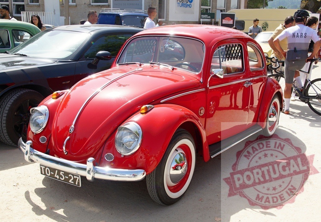 Red Volkswagen Beetle parked at vintage car show | Bright red classic Volkswagen Beetle parked outdoors at a public event - Realized with Pictrs.com