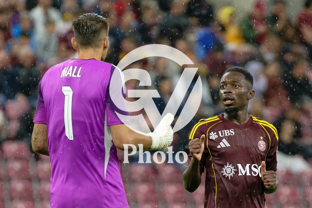 UEFA Conference League Play-offs 2nd leg - Servette FC v FC Shakhtar Donetsk | Bradley Mazikou (18 Servette FC) speaks with Joel Mall (1 Servette FC) during the UEFA Conference League Play-offs 2nd leg match between Servette FC and FC Shakhtar Donetsk at Stade de Geneve in Geneva, Switzerland