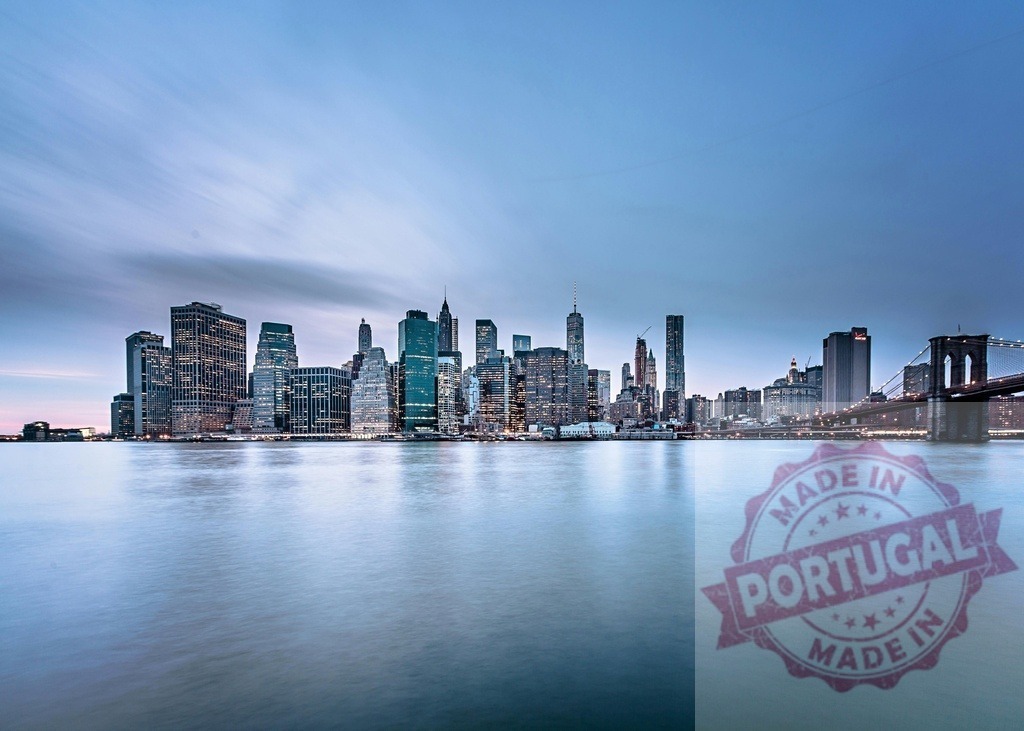 New York City skyline with Brooklyn Bridge at blue hour | New York City skyscrapers lining the waterfront, reflecting on East River during blue hour - Realized with Pictrs.com