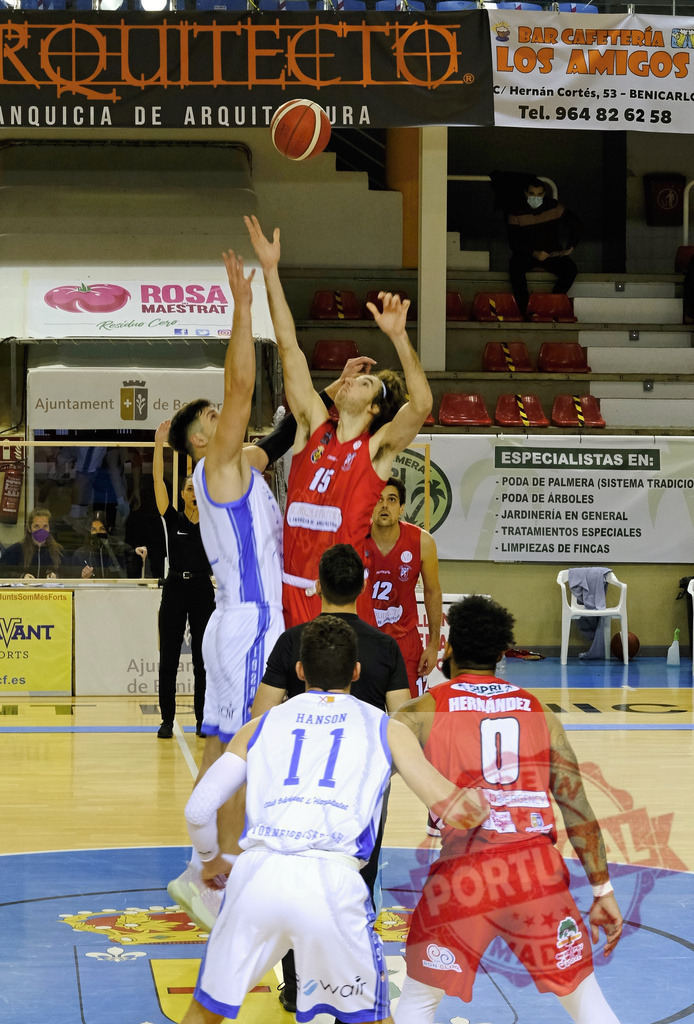 Basketball players jumping for ball during game | Two competitive basketball players reaching for the ball during a dynamic game on the court - Realized with Pictrs.com
