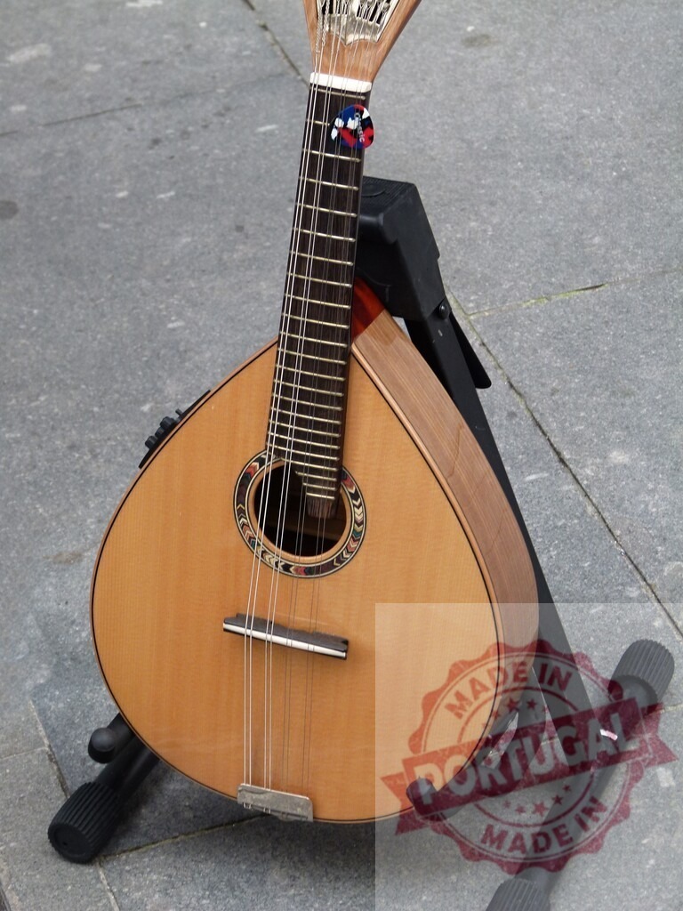 Portuguese guitar resting on a stand on a cobblestone street | Traditional portuguese guitar resting on a stand on a cobblestone street, ready to be played - Realized with Pictrs.com