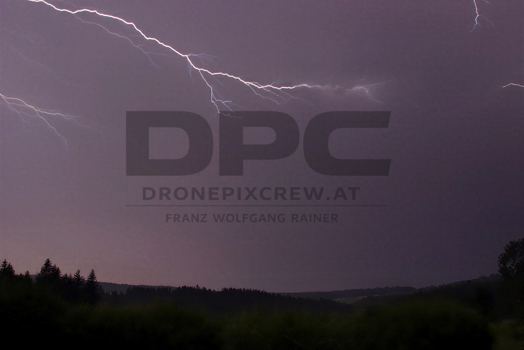 Lightning Storm over the Almenland | Multiple lightning strikes illuminate the night sky over the Almenland region in Austria during a powerful summer thunderstorm. - Realisiert mit Pictrs.com