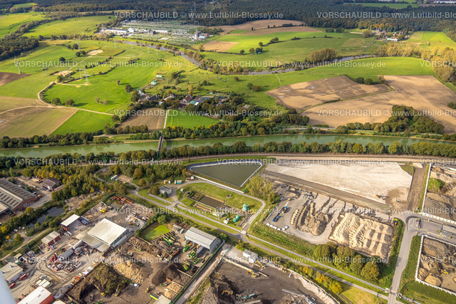 Huenxe241009843 | Luftbild, Gewerbepark Bucholtwelmen-West mit R-Gestein Niederrhein Nassaufbereitungsanlage der HDB Recycling GmbH am Wesel-Datteln-Kanal, Kanalbrücke Welmer Weg, Umspannanlage Niederrhein, Welmer Weg und Umspannanlage Niederrhein Amprion, Bucholtwelmen, Hünxe, Niederrhein, Nordrhein-Westfalen, Deutschland