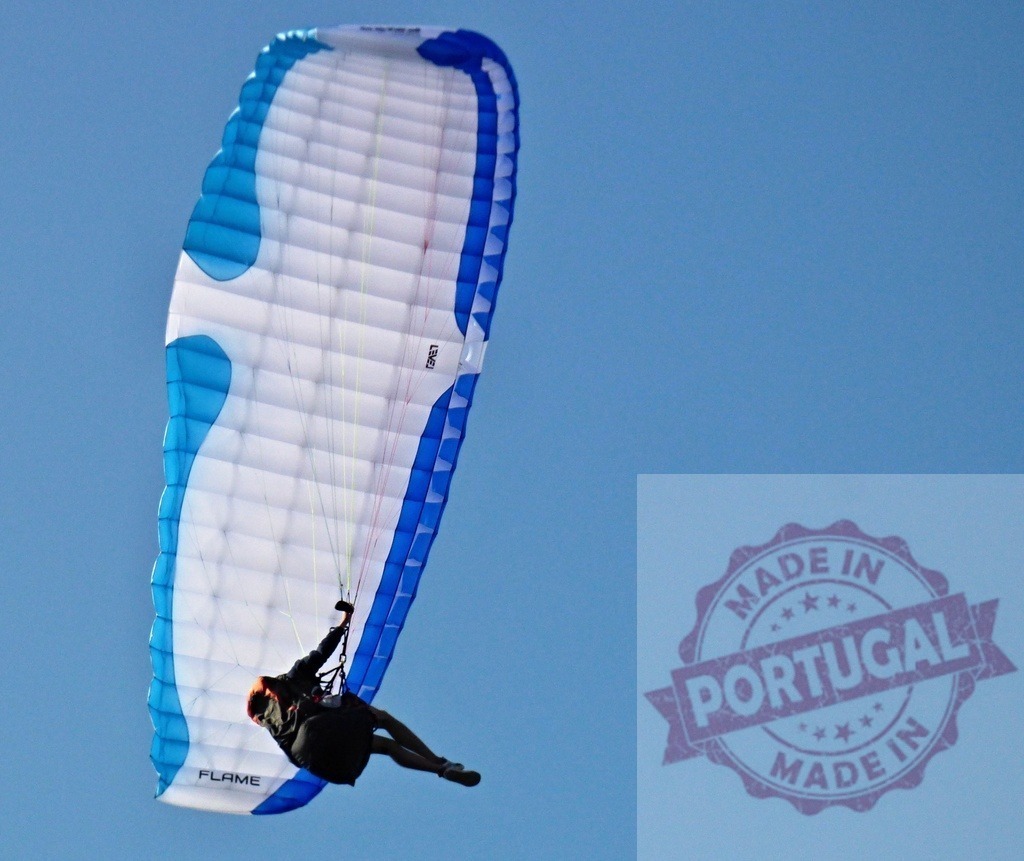 Paraglider flying in blue sky during extreme sport | Person enjoying paragliding activity, soaring high in a clear blue sky - Realized with Pictrs.com