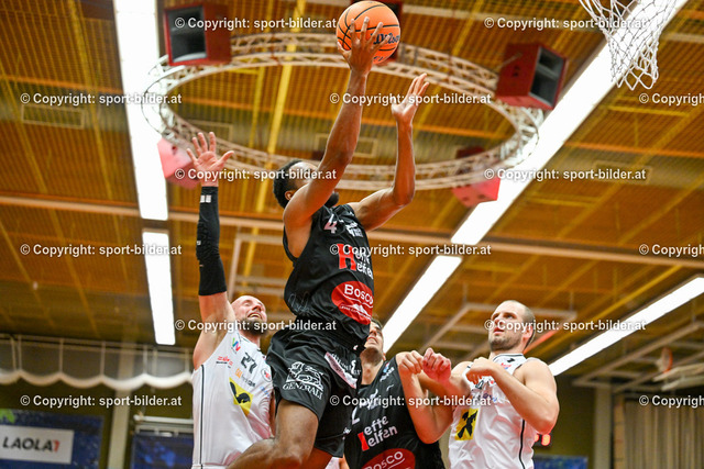 AUT, BSL, Basketball Flyers Wels vs Bulls Kapfenberg | 19.10.2024, Raiffeisen Arena Wels, AUT, BSL, Flyers Wels vs Bulls Kapfenberg, im Bild Christian von Fintel of Raiffeisen Flyers Wels, Henry Tanksley of Bosco Bulls Kapfenberg, Nemanja Krstic of Bosco Bulls Kapfenberg and Renato Poljak of Raiffeisen Flyers Wels// BSL, Basketball Super League Match between Raiffeisen Flyers Wels and Bulls Kapfenberg in Wels, Austria on 2024/10/19