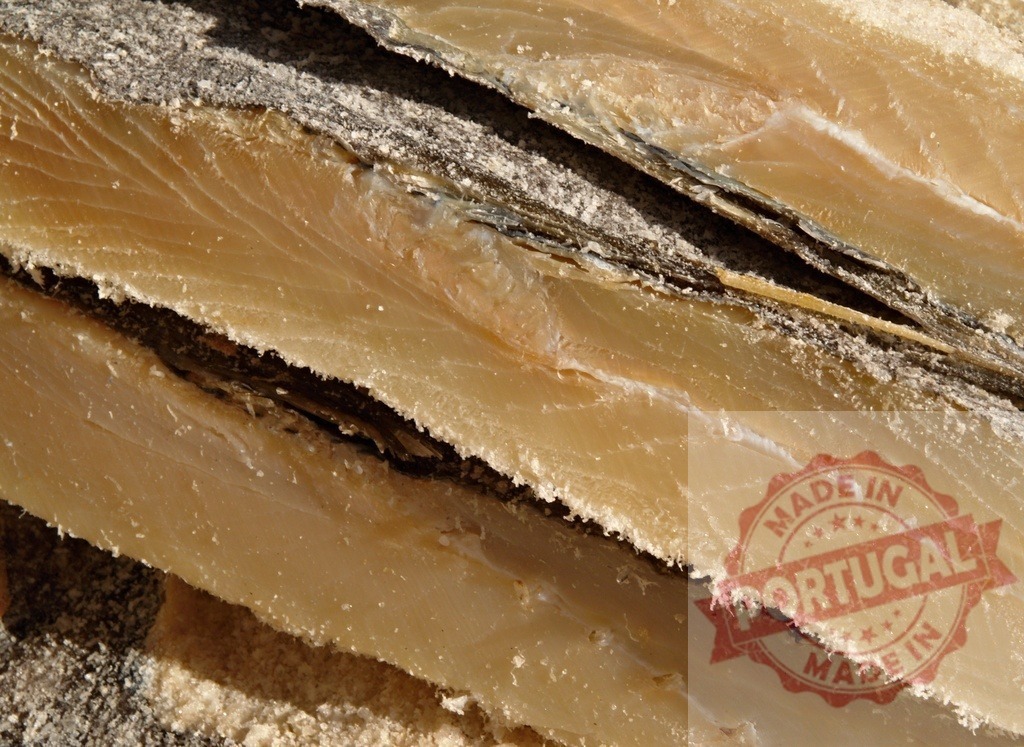 Dried salted cod fish fillets bacalhau ingredient | Dried salted cod fish fillets showing texture and preservation method - Realized with Pictrs.com