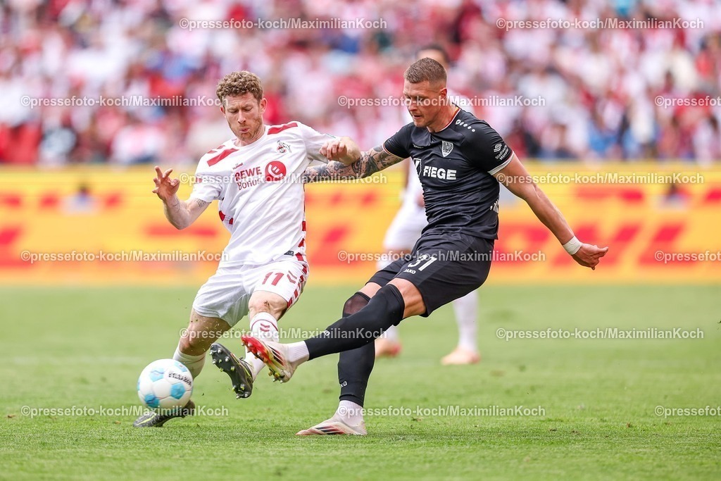 1FC20042501194 | 20.04.2025, Fußball, 1. FC Köln - Preußen Münster, 2.. Fußball Bundesliga, 30. Spieltag, RheinEnergie-STADION, Saison 2024 2025: Florian Kainz (FC Koeln #11) im Zweikampf gegen Holmbert Aron Fridjonsson (Preussen Muenster #31) DFB regulations prohibit any use of photographs as image sequences and or quasi-video.