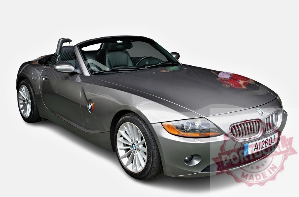 BMW Z4 luxury roadster isolated on white background | BMW Z4 convertible sports car in gray color on a plain white background - Realized with Pictrs.com