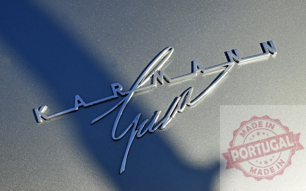 Volkswagen Karmann Ghia classic car chrome emblem closeup | Chrome logo emblem of a vintage Volkswagen Karmann Ghia car, highlighting classic design - Realized with Pictrs.com