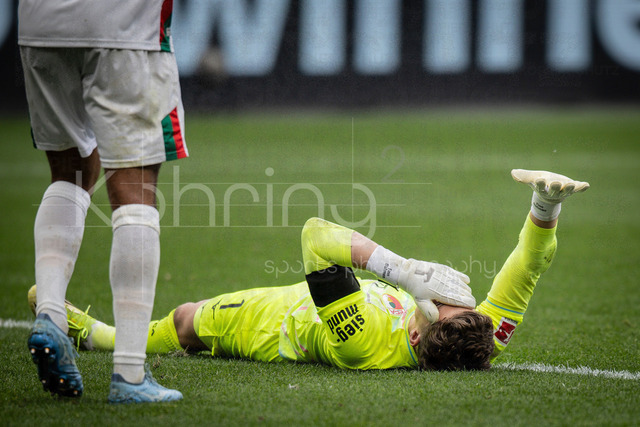 German Bundesliga, Bayer 04 Leverkusen vs. FC Augsburg, 18.04.2026 | LEVERKUSEN, GERMANY - APRIL 18, 2026 :  Keeper Finn Dahmen (FC Augsburg, 1) is injured during the German Bundesliga match on gameday 30 between Bayer 04 Leverkusen vs. FC Augsburg at BayArena on April 18, 2026 in Leverkusen, Germany. DFL REGULATIONS PROHIBIT ANY USE OF PHOTOGRAPHS AS IMAGE SEQUENCES AND/OR QUASI-VIDEO.