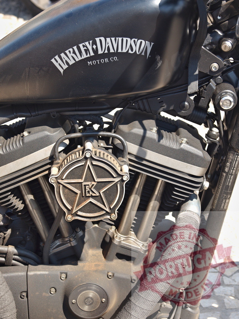 Harley-Davidson motorcycle v-twin engine closeup showing custom details | Harley-Davidson v-twin engine with custom star cover and wrapped exhaust pipe - Realisiert mit Pictrs.com