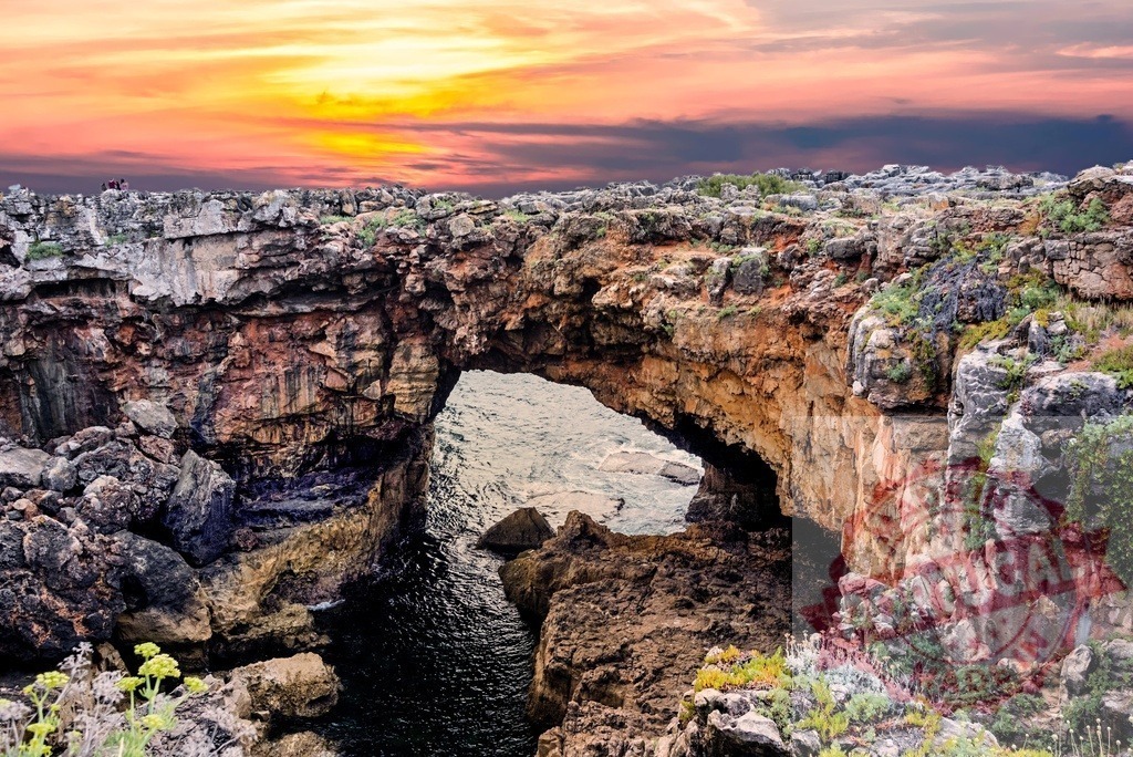 Boca do Inferno rock arch coastline at sunset | Boca do Inferno rock arch creating a natural tunnel to the sea under a colorful sunset sky - Realisiert mit Pictrs.com
