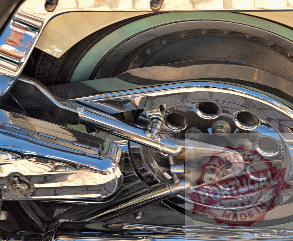 Motorcycle engine chrome parts with shiny metallic details | Motorcycle engine showing intricate chrome components with polished metallic surfaces - Realized with Pictrs.com