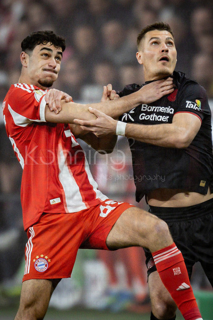 DFB Cup semifinal match Bayer 04 Leverkusen vs. FC Bayern Munich, 22.04.2026 | LEVERKUSEN, GERMANY - APRIL 22, 2026: Aleksandar Pavlovic (FC Bayern Muenchen, 45) and Patrik Schick (Bayer 04 Leverkusen, 14) tackling during the German DFB Cup semifinal match between Bayer 04 Leverkusen vs. FC Bayern Munich at BayArena on April 22, 2026 in Leverkusen, Germany. DFL REGULATIONS PROHIBIT ANY USE OF PHOTOGRAPHS AS IMAGE SEQUENCES AND/OR QUASI-VIDEO.