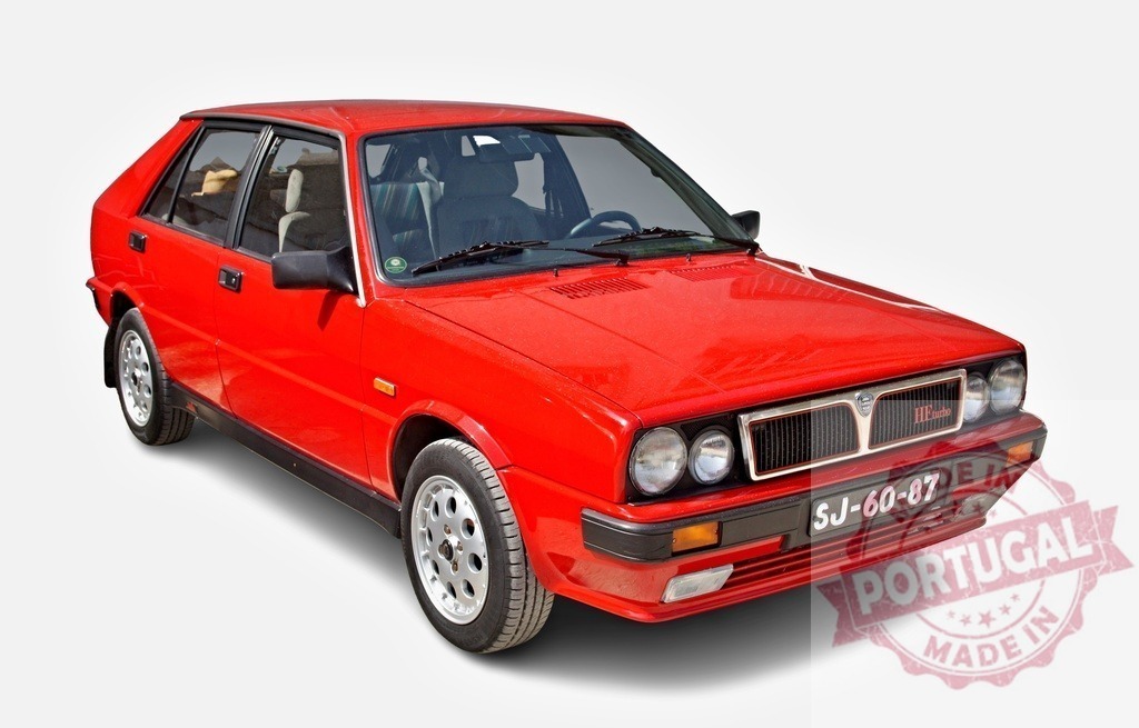 Classic red Lancia Delta HF Turbo isolated on white background | Red Lancia Delta HF Turbo showing its front on a white background - Realized with Pictrs.com