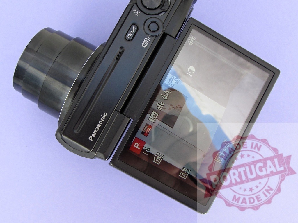 Panasonic digital camera with flip out LCD screen | Panasonic digital camera displaying settings on its articulating LCD screen - Realized with Pictrs.com