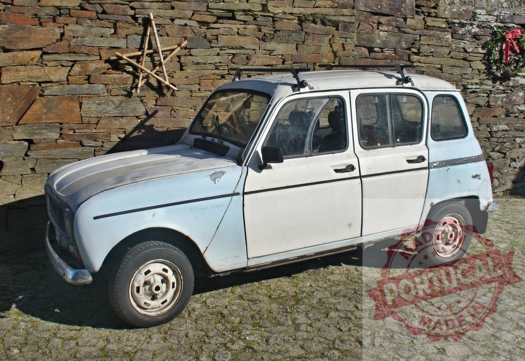 Renault 4 vintage car parked by stone wall | Renault 4 vintage classic car parked on cobblestone street near a rustic stone wall - Realized with Pictrs.com