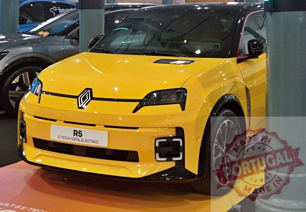 Renault R5 E-Tech electric car in yellow at exhibition | Renault R5 E-Tech 100% electric vehicle displayed, showcasing modern automotive design - Realized with Pictrs.com