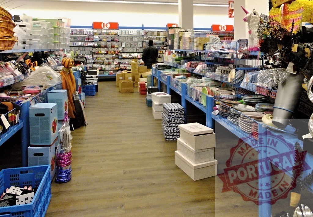 Discount store aisle with consumer browsing items | Person walking through a discount store aisle with shelves full of varied merchandise - Realized with Pictrs.com