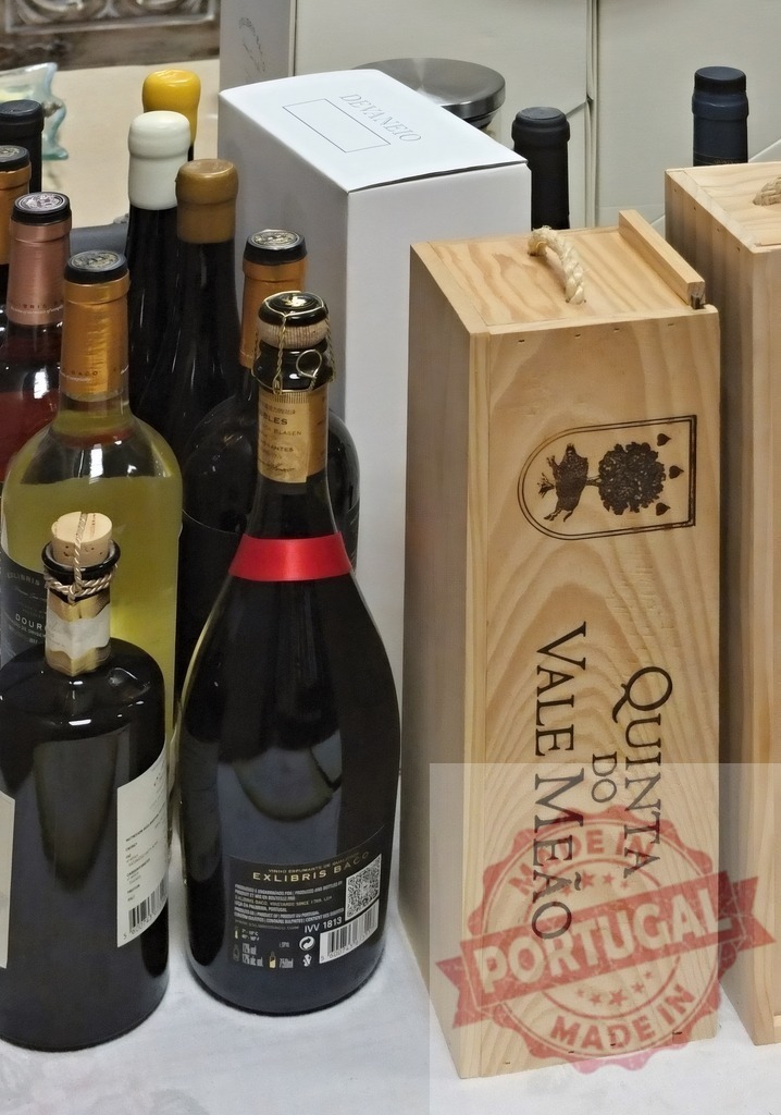 Quinta do Vale Meão wine and liquor bottles collection | Various wine, champagne, and spirit bottles with Quinta do Vale Meão wooden crate - Realized with Pictrs.com