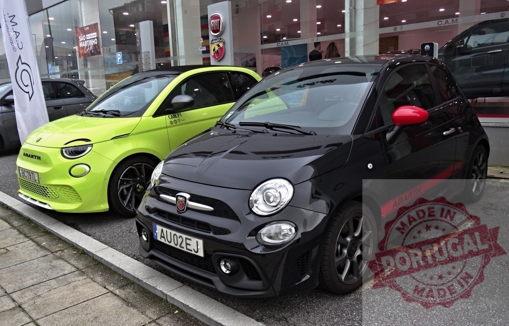 Abarth 595 and electric 500e cars parked at Fiat dealership | Abarth 595 and 500e showcasing automotive performance and electric mobility - Realized with Pictrs.com