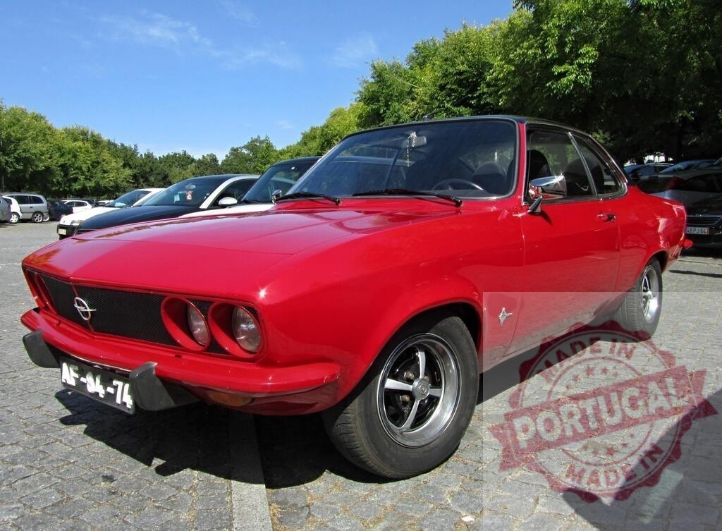 Shiny red Opel Manta A parked in a parking lot | Classic Opel Manta A glistening under the summer sun in a parking lot - Realisiert mit Pictrs.com