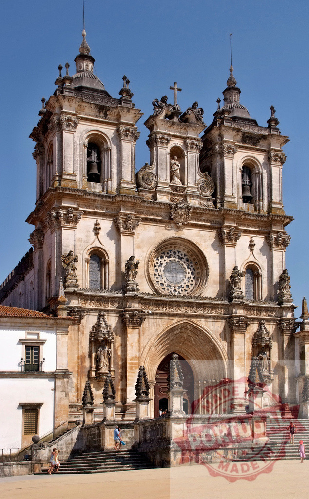 Alcobaça Monastery Baroque facade in Portugal | Alcobaça Monastery's ornate Baroque facade showcases ancient Portuguese architecture under clear blue sky - Realisiert mit Pictrs.com
