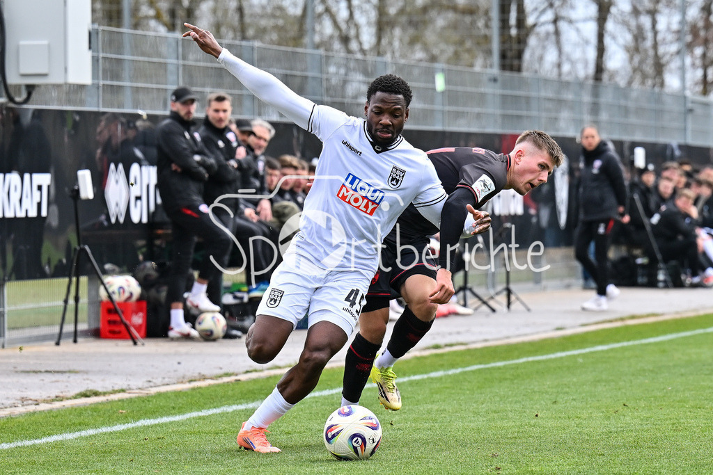 FC Ingolstadt - SSV Ulm 1846 Fussball  | INGOLSTADT, GERMANY - 25. MAERZ: im Duell Streli MAMBA (SSV Ulm 45) und Gustav CHRISTENSEN (FC Ingolstadt 24) während dem Testspiel zwischen dem FC Ingolstadt und dem SSV Ulm 1846 Fussball auf Platz 4 am Audi Sportpark