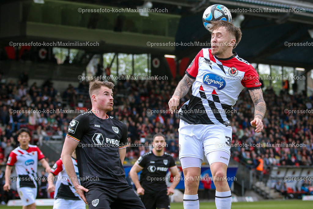 Koe3Liga27042402137 | 27.04.2024, Köln, Fußball, bwin 3. Liga Herren, Sportpark Höhenberg, 35. Spieltag, Saison 2023 2024, FC Viktoria Köln – Preußen Münster: Niko Koulis (Preußen Münster) Kopfball Luca Marseiler (Viktoria Köln). 
DFB regulations prohibit any use of photographs as image sequences and or quasi-video.