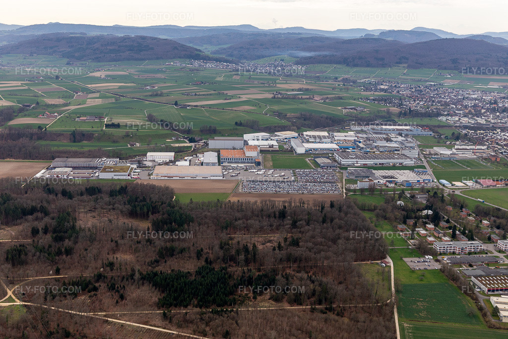 Aerial view: Technical facilities in the Riburg industrial area with Rodi Fructus, Kühne + Nagel, DPD, Galliker Transport AG and Louis Ditzler AG in Möhlin in the state Aargau, Switzerland. – Photo: IMG_120115.jpg taken on 03/17/2020 by Werner Riehm/FLY-FOTO.com – Resolution of the original: 5472 x 3648 px