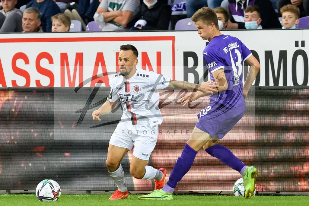 OSNVKO2021090620210906_114 | Fussball, Herren: Simon Handle (FC Viktoria Koeln) und Lukas Kunze (VfL Osnabrueck)  beim Spiel der 3. Liga zwischen VfL Osnabrueck und FC Viktoria Koeln im Stadion an der Bremer Bruecke am 06.09.2021 in Osnabrueck, Deutschland.DFB / DFL REGULATIONS PROHIBIT ANY USE OF PHOTOGRAPHS AS IMAGE SEQUENCES AND/OR QUASI-VIDEO. - Realisiert mit Pictrs.com