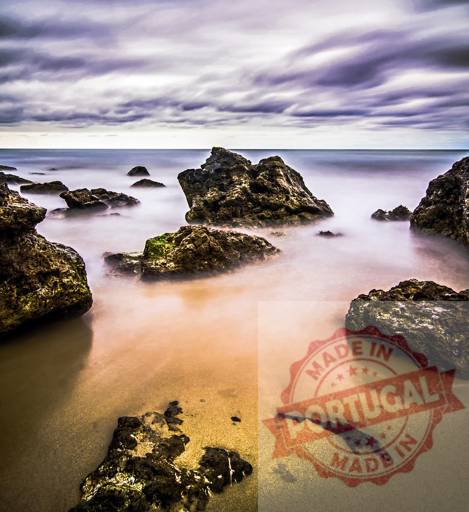 Rocks emerging from the misty sea under a cloudy sky | Long exposure photography of rocks emerging from the misty sea under a cloudy sky - Realized with Pictrs.com