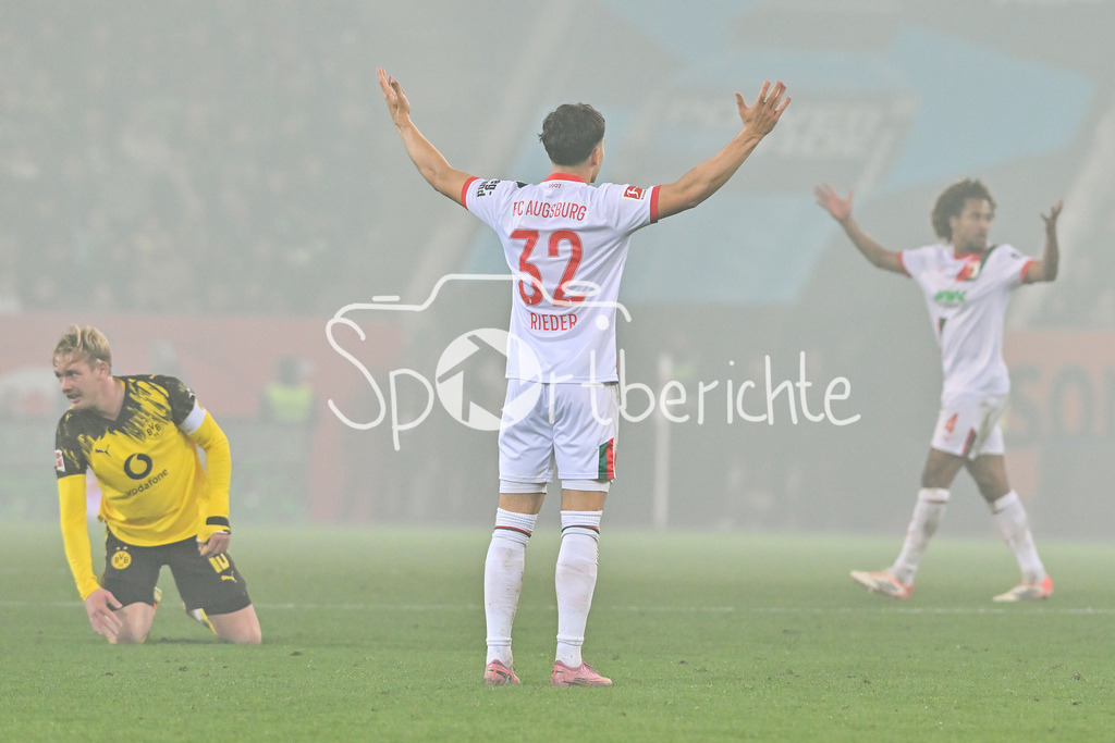 FC Augsburg - Borussia Dortmund | AUGSBURG, GERMANY - Julian BRANDT (Borussia Dortmund 10 and Fabian RIEDER (FC Augsburg 32) during the bundesliga match between FC Augsburg vs. Borussia Dortmund on matchday 9 at WWK Arena on October 31, 2025 in Augsburg, Germany / DFL REGULATIONS PROHIBIT ANY USE OF PHOTOGRAPHS AS IMAGE SEQUENCES AND/OR QUASI-VIDEO