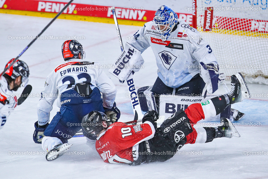 KoeDEL13032401030 | 13.03.2024, Köln, Eishockey, Penny DEL, Pre-Playoffs Spieltag 2, Lanxess-Arena, Kölner Haie - ERC Ingolstadt: Justin Schütz (Kölner Haie) rutscht in Richtung Tor von Torhüter Michael Garteig (ERC Ingolstadt)