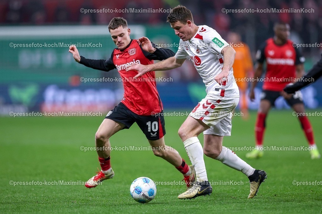 DFB05022502247 | 05.02.2025, Fußball, DFB-Pokal Viertelfinale, Bayer 04 Leverkusen - 1.FC Köln, BayArena, Saison 2024 2025: Florian Wirtz (Bayer04 Leverkusen #10) im Zweikampf gegen Dominique Heintz (FC Köln #3)DFB regulations prohibit any use of photographs as image sequences and or quasi-video.