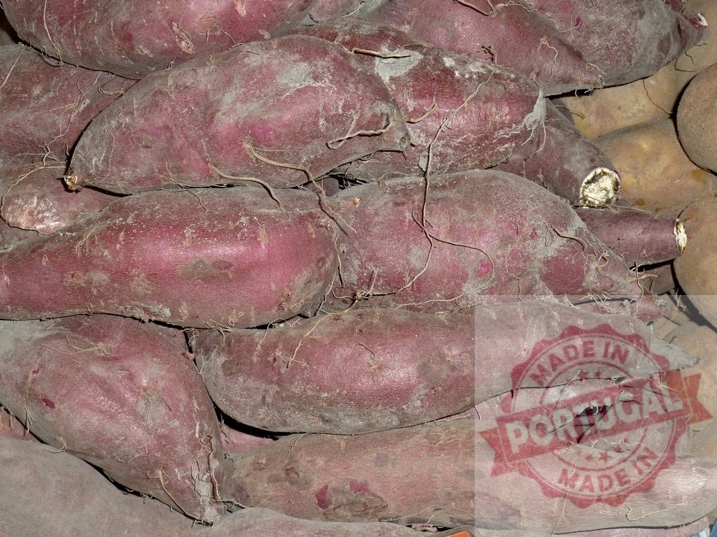 Fresh purple sweet potatoes root crop harvest | Sweet potatoes with purple skin and dirt showing agriculture food ingredient - Realized with Pictrs.com