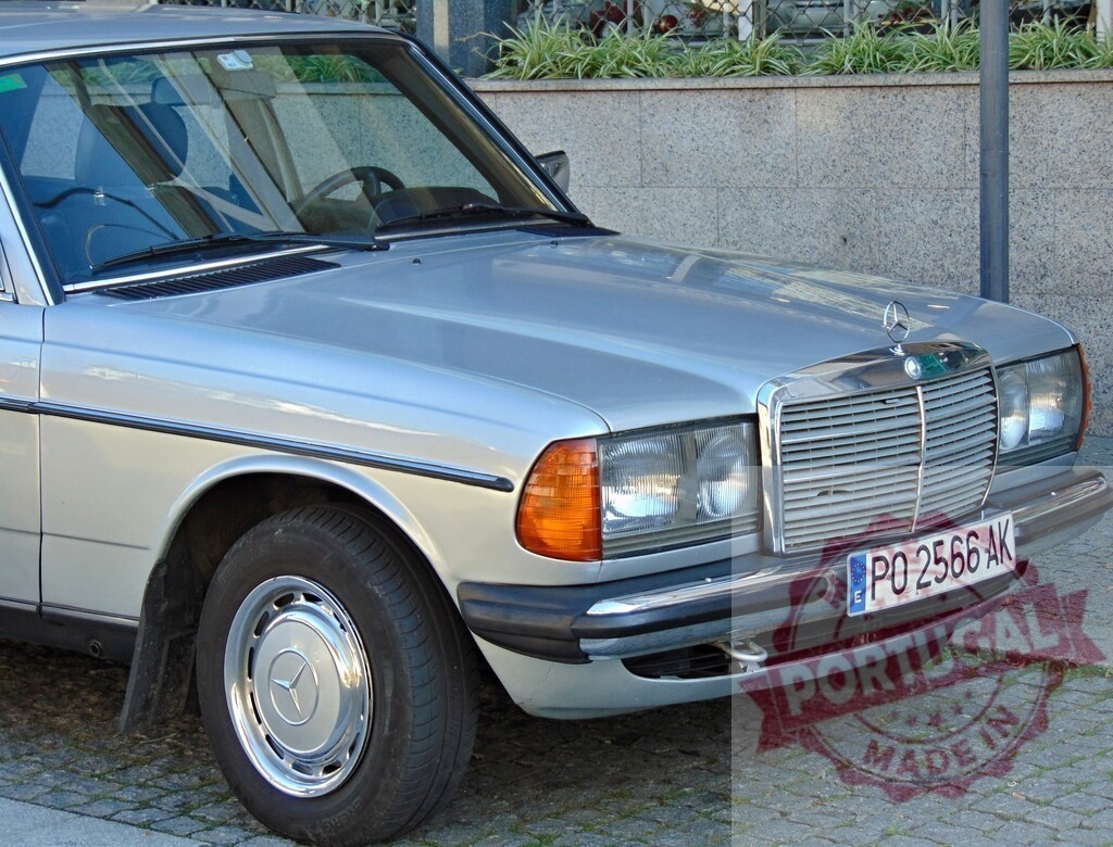 Silver Mercedes-Benz W123 parked on cobblestone street | Classic silver Mercedes-Benz W123 showcasing its iconic design, parked on a cobblestone street - Realized with Pictrs.com