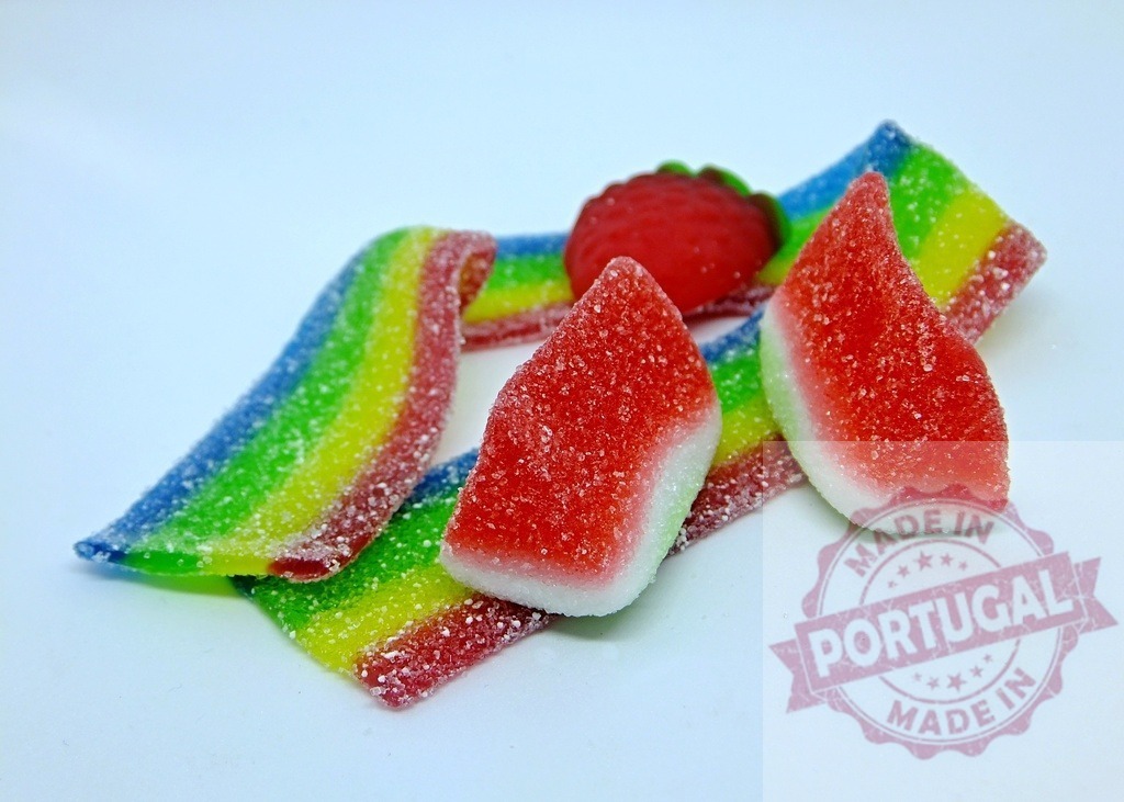 Colorful sugar coated gummy candies and rainbow belts | Chewy sugar coated gummy candies shaped like watermelon slices, a strawberry, and rainbow belts - Realized with Pictrs.com