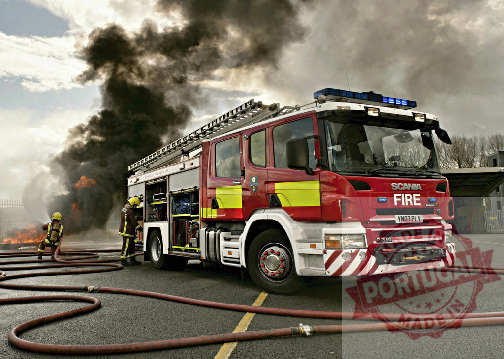 Firefighters battling blaze with Scania fire engine | Firefighters operating a fire engine to extinguish a large blaze with thick smoke - Realized with Pictrs.com