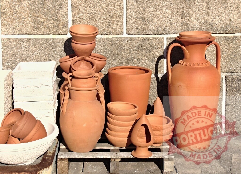 Terracotta pots and bowls displayed for sale | Collection of terracotta pottery for sale, including various pots, amphoras, and bowls - Realized with Pictrs.com